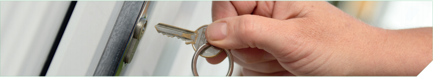 An image of a key about to be put into a lock
