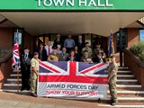 Dignitaries congregate at Redditch Town Hall for a flag-raising ceremony